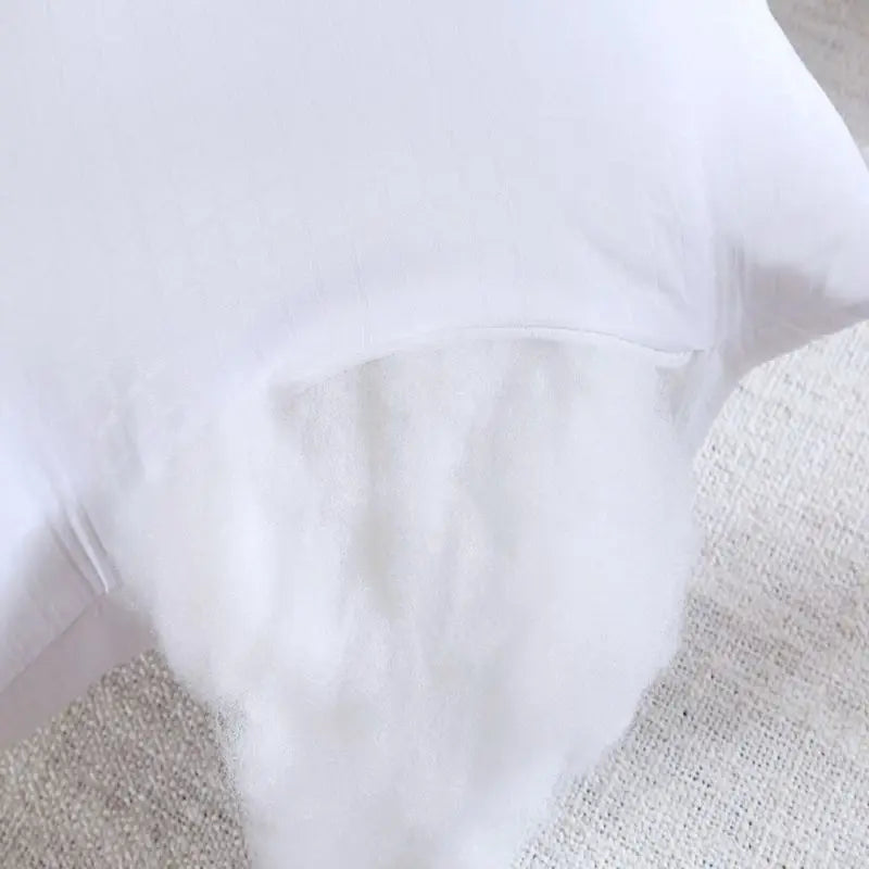 COCON — Gros plan sur le remplissage en fibre creuse du coussin de corps