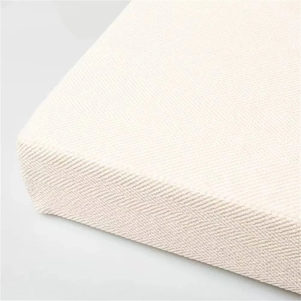 BANQUETTE — Coin du coussin de banc en tissu texturé, coloris Crème