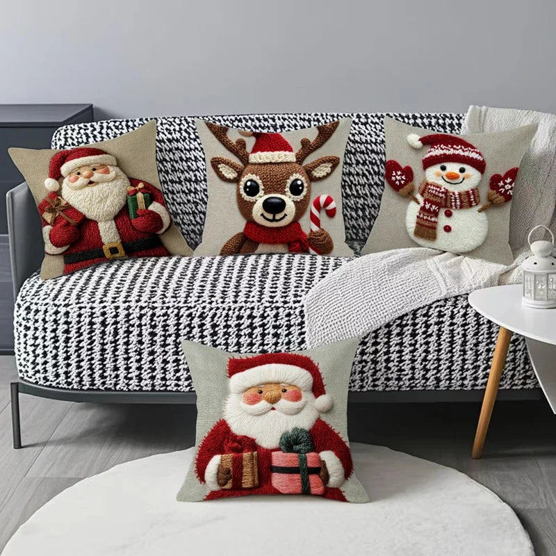 RENNE — Quatre housses de coussin de Noël illustrées sur un canapé à motif pied-de-poule