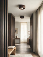 NID, plafonnier dôme en bois, finition Noyer, deux luminaires dans un couloir | Maison Beaurel