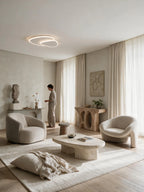 SPIRE, plafonnier LED, allumé dans un salon avec fauteuils | Maison Beaurel